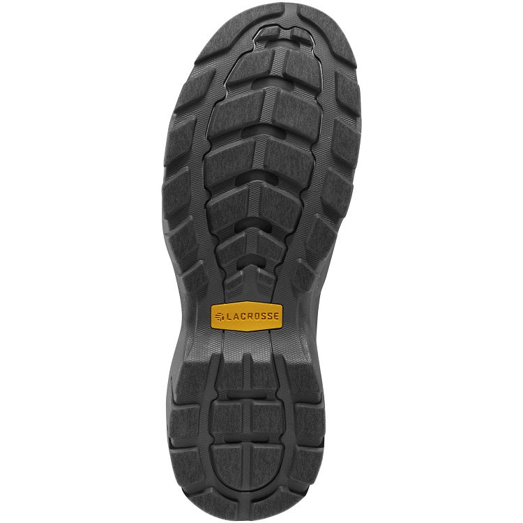 The image shows the sole of Lacrosse Alpha Muddy Shoes Brown 4.5" 3mm Neoprene, with a rugged tread for all-terrain traction. A small yellow rectangular label near the heel bears the "LaCrosse" brand name, highlighting its durable design.