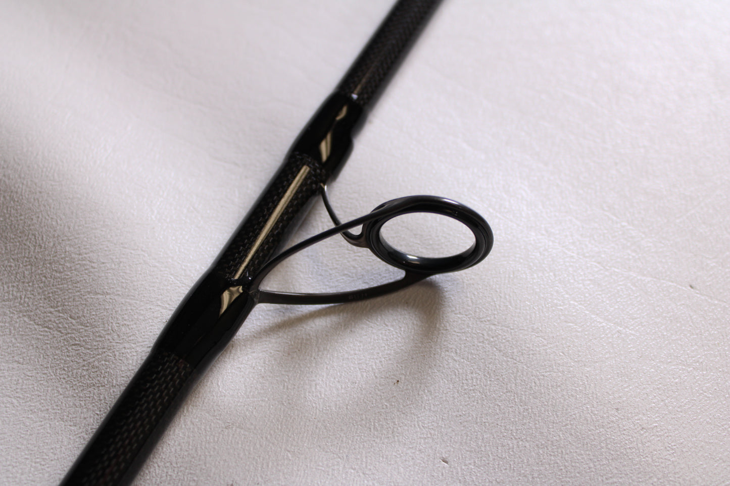 Close-up of the ODM Rods Frontier X NXFX-1064 10'6" Mod-Mod Fast 2 Piece Spinning Rod guide (eyelet), used but in mint condition—ideal for those exploring quality pre-owned gear or trade-in options for store credit.