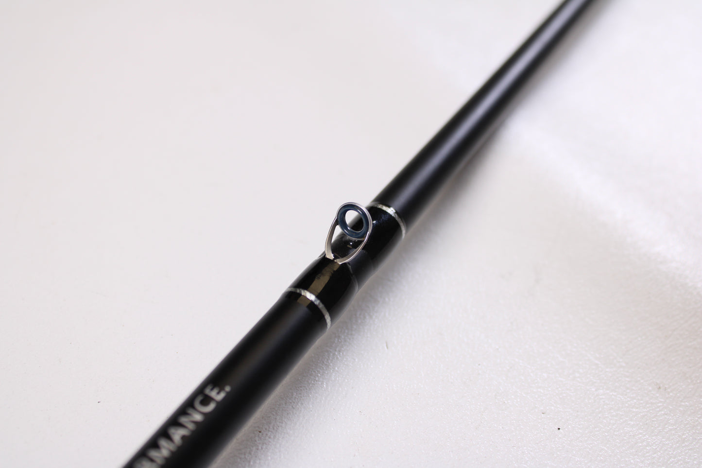 Close-up of an FXtreme Angler Series WSB69MHXF 6'9" Medium Heavy casting rod in very good condition, showing a metal line guide and "PERFORMANCE." text—ideal for trade-in to earn store credit for used FXtreme gear.