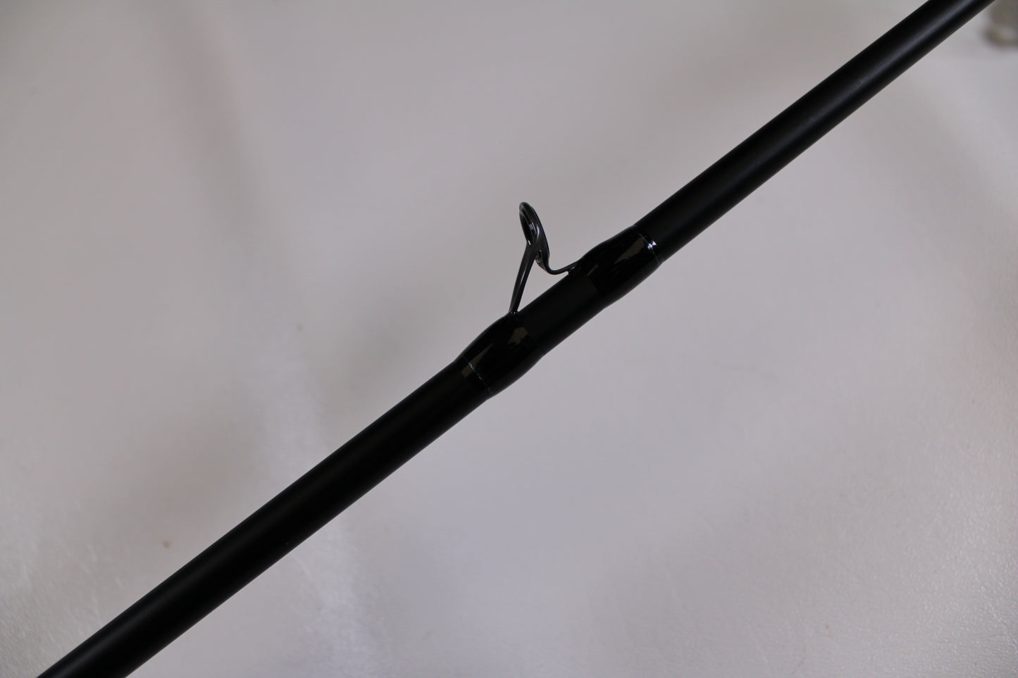 Close-up of a Dobyns Champion XP DC795SB Used Casting Rod in excellent condition, featuring a single metal guide ring—perfect for upgrading your fishing gear or trading in through our rod and reel program.