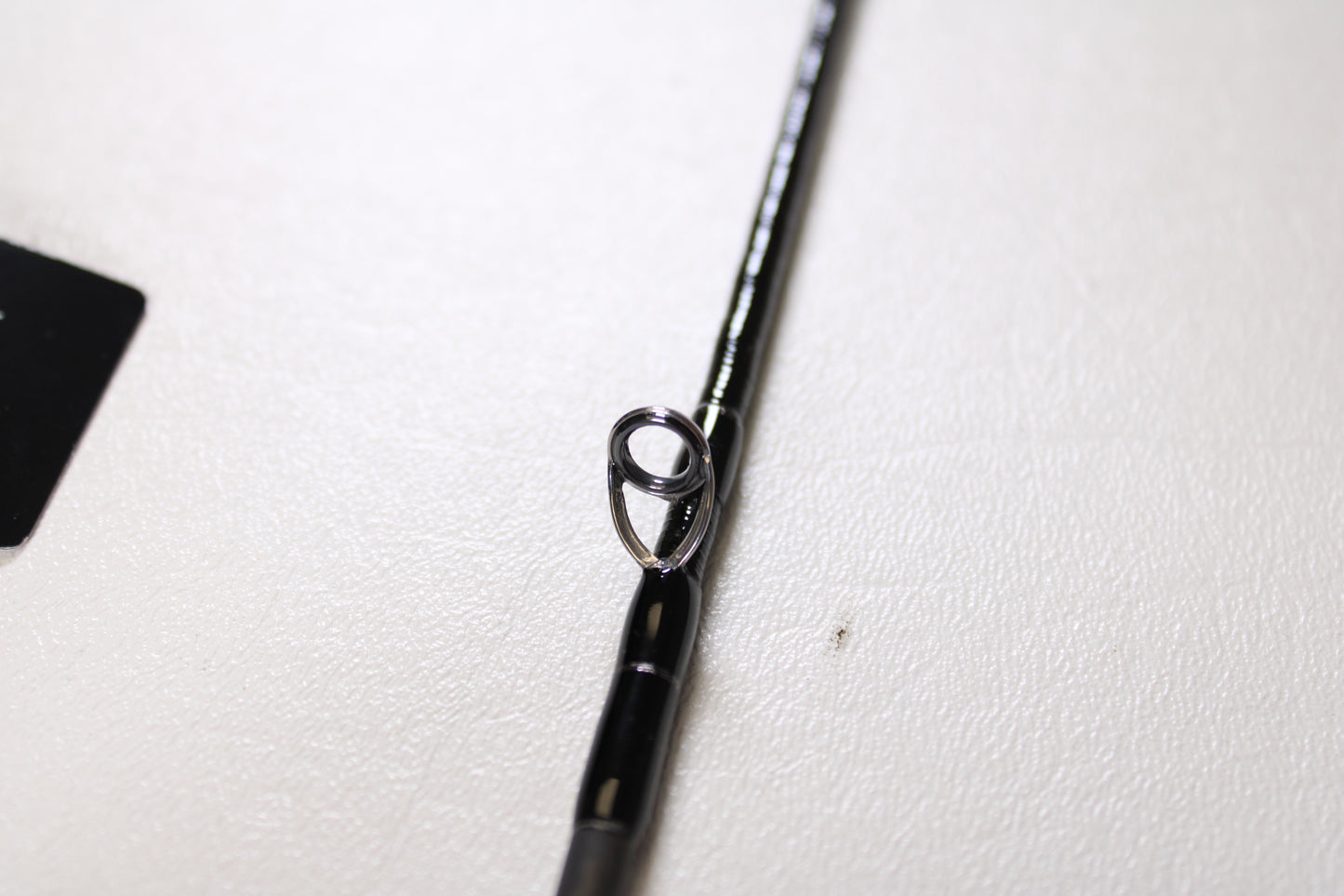 Close-up of a Shimano Cardiff Steam Premium B48UL-G/4 4'8" Ultra Light 4pc Used Casting Rod in mint condition, highlighting a metal line guide. Perfect for our Rod and Reel Trade-In Program—exchange your used gear for store credit.