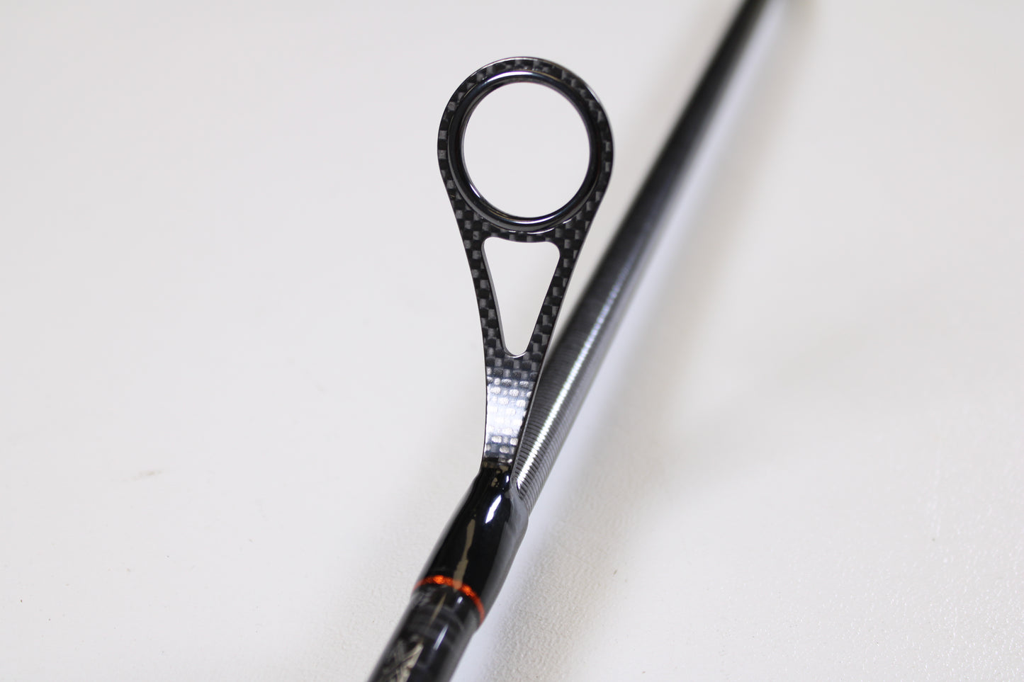 Close-up of a Daiwa Sol AGS SOLAGS76MFS 7'6" Medium spinning rod guide with black, circular frame and textured design—an excellent condition used rod, ideal for quality gear seekers or our Rod and Reel Trade-In Program.
