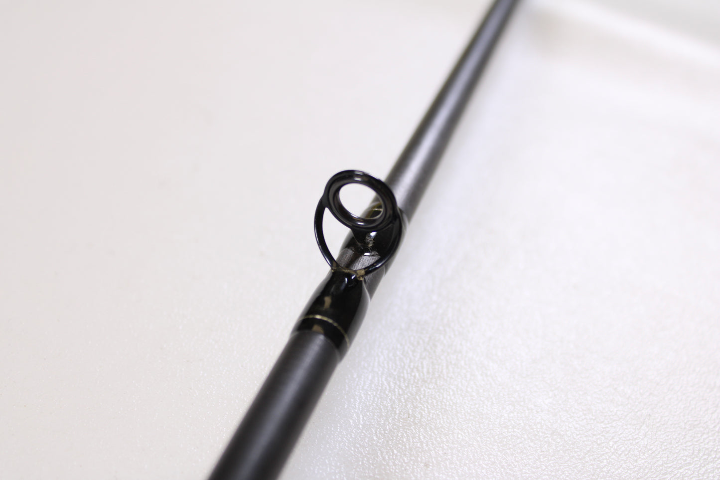 Close-up of the Spiralite Maverick SMC70MMF 7'0" Medium Used Casting Rod in excellent condition, highlighting the metal guide—ideal for those considering our Rod and Reel Trade-In Program or shopping quality used gear.