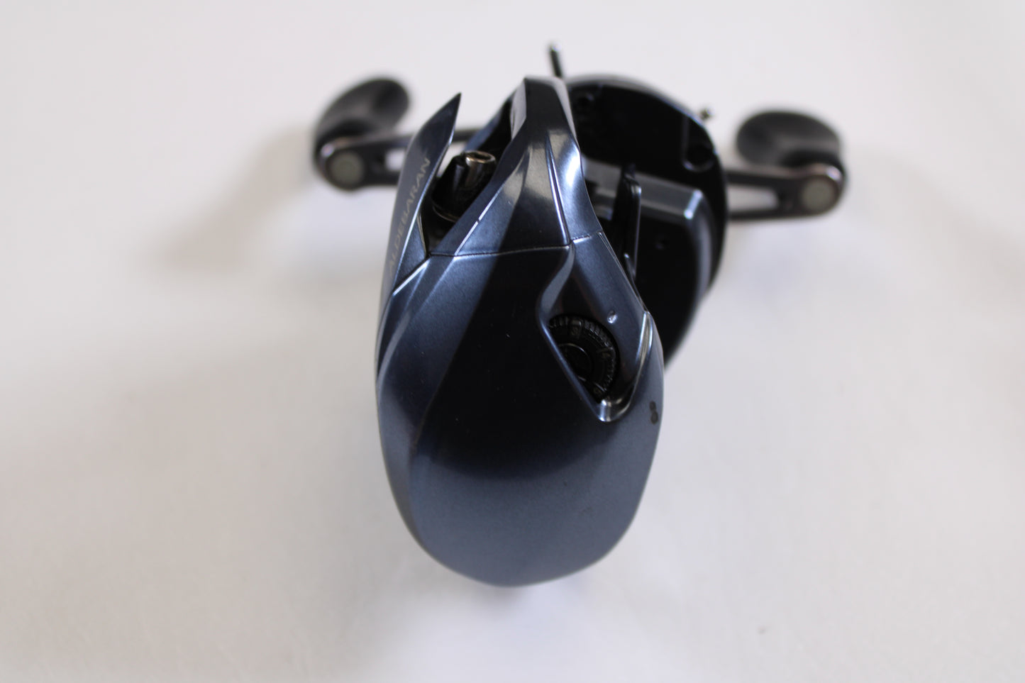 A close-up of a Shimano Aldebaran MGL ALDMGL51 6.5:1 LH used casting reel in very good condition—ideal for upgrading with our Rod and Reel Trade-In Program and earning store credit for your used Shimano gear.