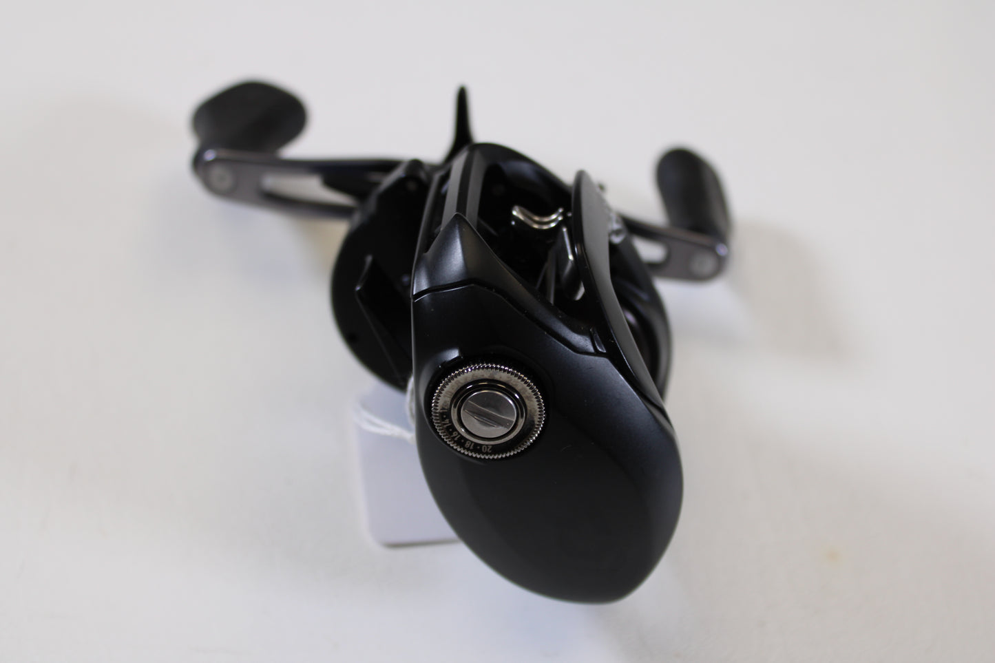 A detailed close-up of a Daiwa Tatula 150 TAT150P 5.5:1 RH - Used Casting Reel in excellent condition—ideal for those interested in trading used gear for store credit through our Rod and Reel Trade-In Program.