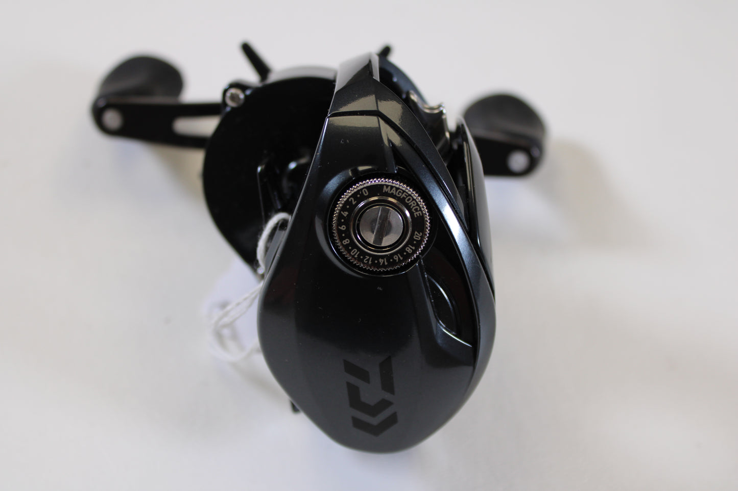 A close-up of a Daiwa Tatula 300 TTU300P 5.3:1 RH used casting reel in excellent condition, with visible MAGFORCE dial and twin handles—ideal for anglers seeking pre-owned gear or rod/reel trade-in store credit.