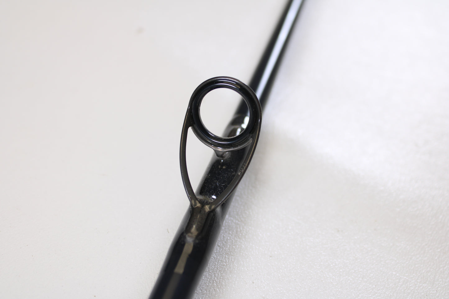 Close-up of the guide ring on a used St. Croix Rift RIFSC73MHMF 7'3" Medium Heavy Conventional Rod—mint condition—ideal for anglers seeking quality gear and great value from St. Croix.