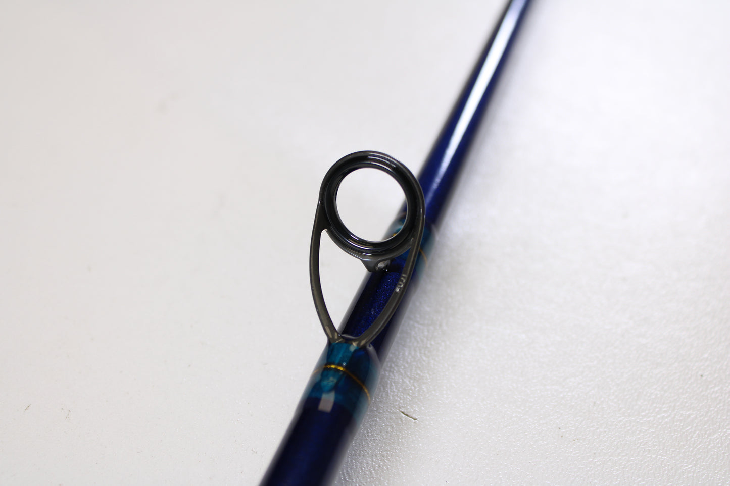 Close-up of the St. Croix Legend Tournament Inshore ITLC711HMF 7'11" Heavy Used Casting Rod (Mint Condition), highlighting a metallic line guide—ideal if you’re considering our Rod and Reel Trade-In Program or an upgrade to your used gear.