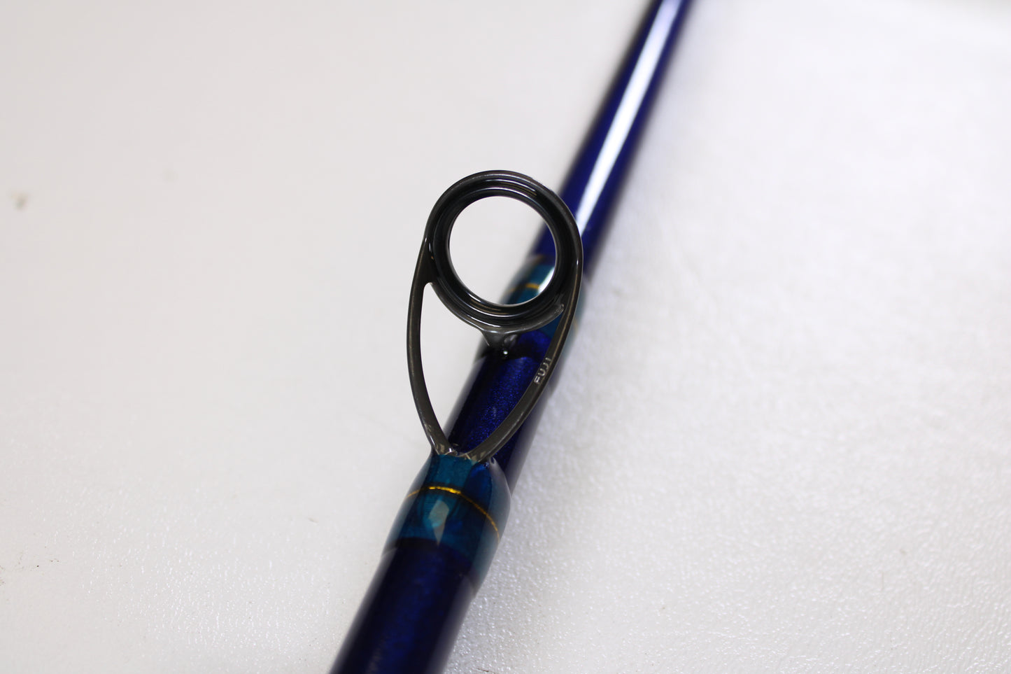 Close-up of the St. Croix Legend Tournament Inshore ITLC79XHMF 7'9" XH Used Casting Rod in mint condition, highlighting a metal guide ring—ideal for anglers upgrading with our Rod and Reel Trade-In Program for store credit.