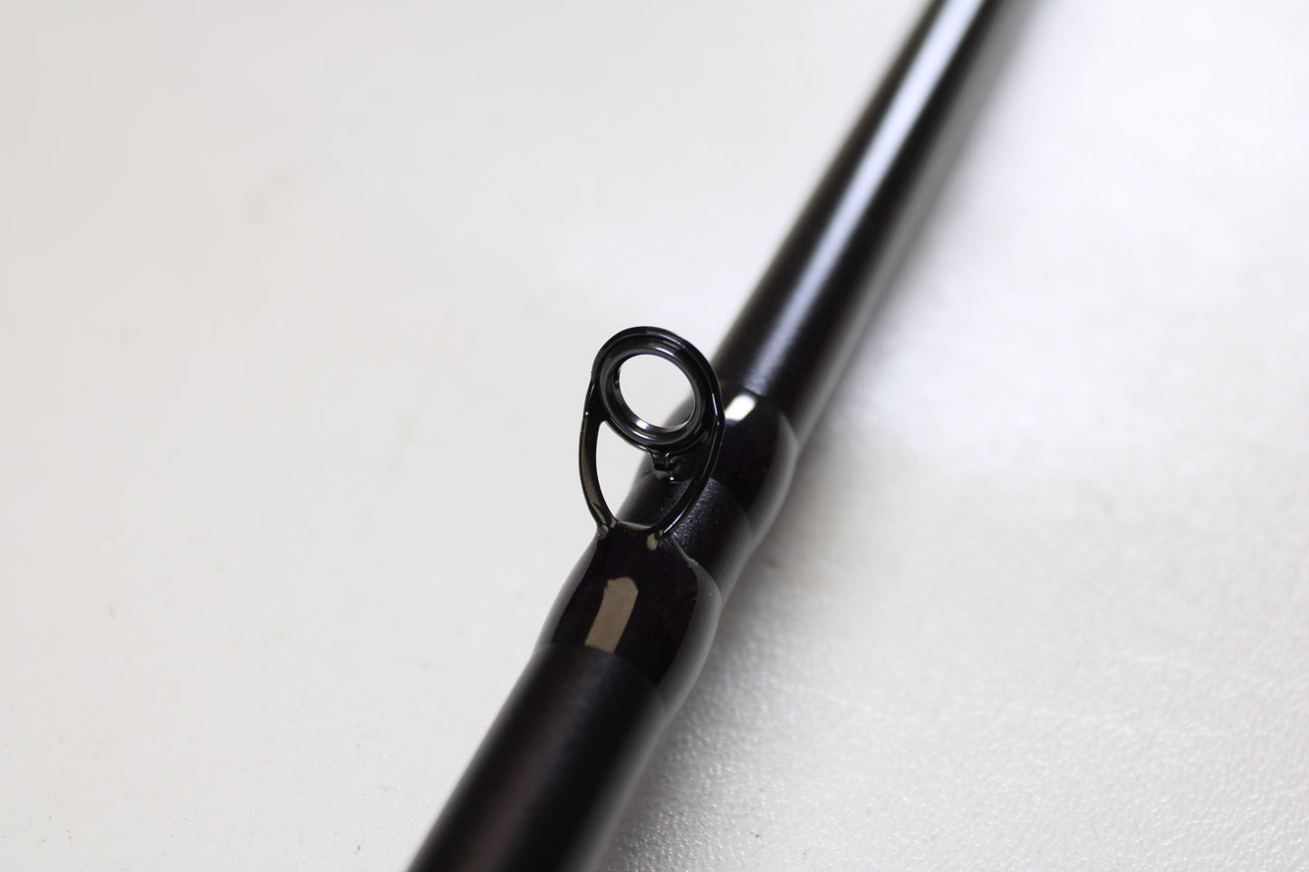 Close-up of a St. Croix Mojo Bass JOC83XXHFT Mag Swimbait 8'3" XXH used casting rod in mint condition highlights its single line guide ring—ideal for those seeking top-quality used St. Croix gear.