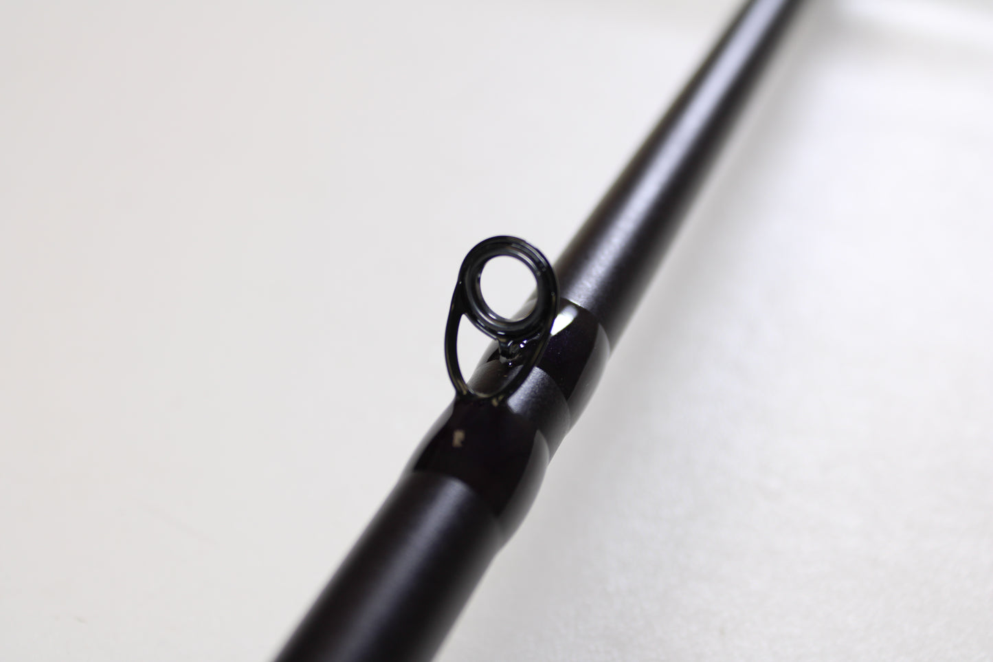 Close-up of the St. Croix Mojo Bass JOC710HF Lite Swimbait 7'10" Heavy Used Casting Rod—mint condition—with a detailed look at the eyelet, perfect for anglers interested in high-quality used St. Croix gear or a rod and reel trade-in for credit.