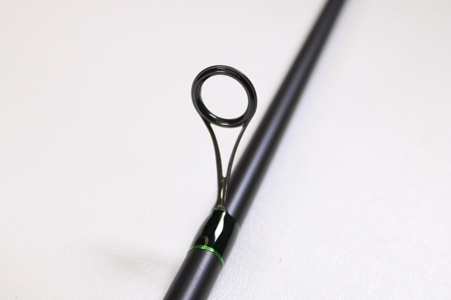 A close-up of the G. Loomis IMX-PRO Steelhead Centerpin 12'0" Heavy 2 Piece Used Spinning Rod in mint condition—ideal for anglers upgrading with our Trade-In Program or earning store credit on used G. Loomis gear.