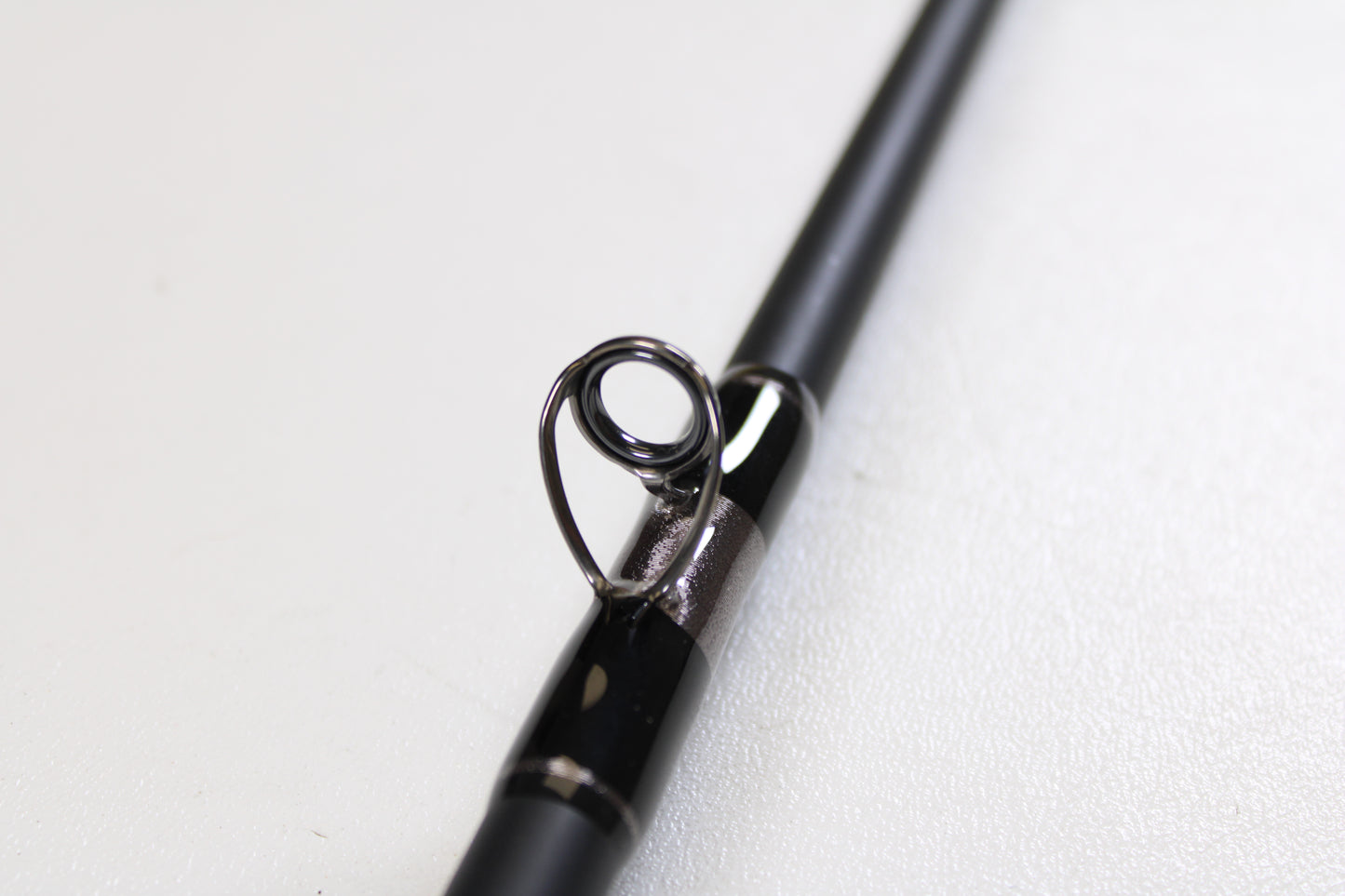 Close-up of the G. Loomis IMX-PRO Offshore 96-30 8'0" Medium Used Casting Rod in mint condition—ideal for anglers considering our Rod and Reel Trade-In Program.