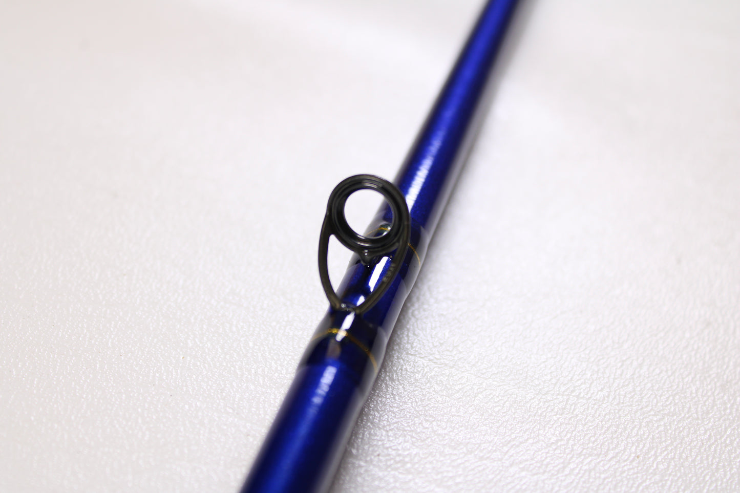 A close-up of the St. Croix Legend Tournament Pike LTPC223HF2 7'4" Heavy 2-Piece Used Casting Rod in mint condition, highlighting its metal line guide—ideal for those seeking to upgrade their gear or explore our rod and reel trade-in program.