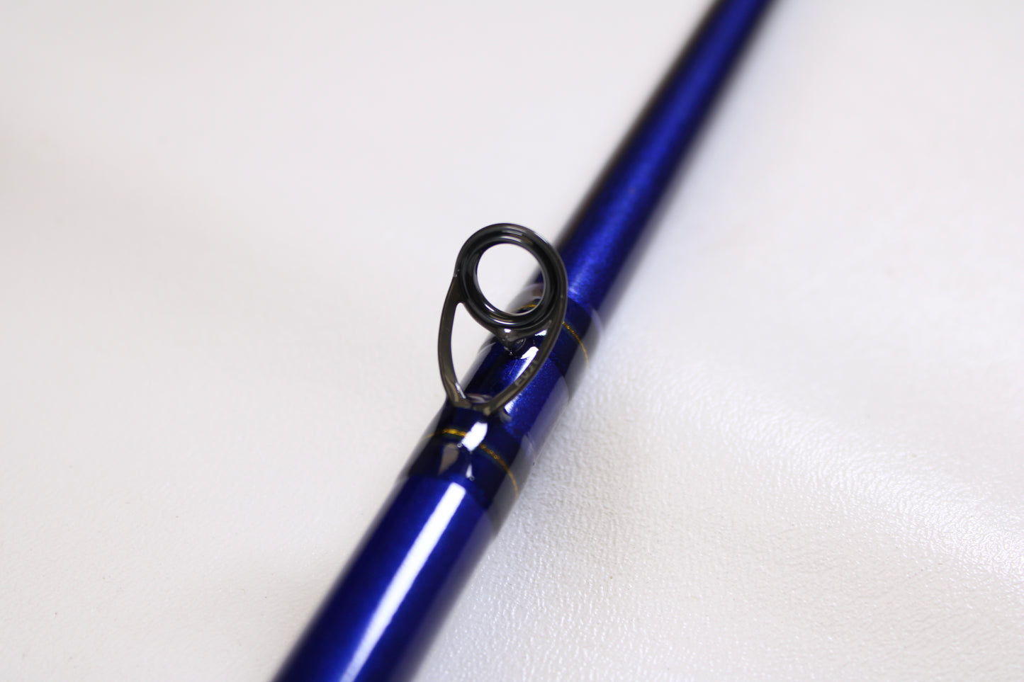 A close-up of the St. Croix Legend Tournament Pike LTPC259XHF2 8'6" Used Casting Rod—shown for our Rod and Reel Trade-In Program—highlights a line guide, ideal for anglers looking to upgrade used St. Croix gear for store credit.