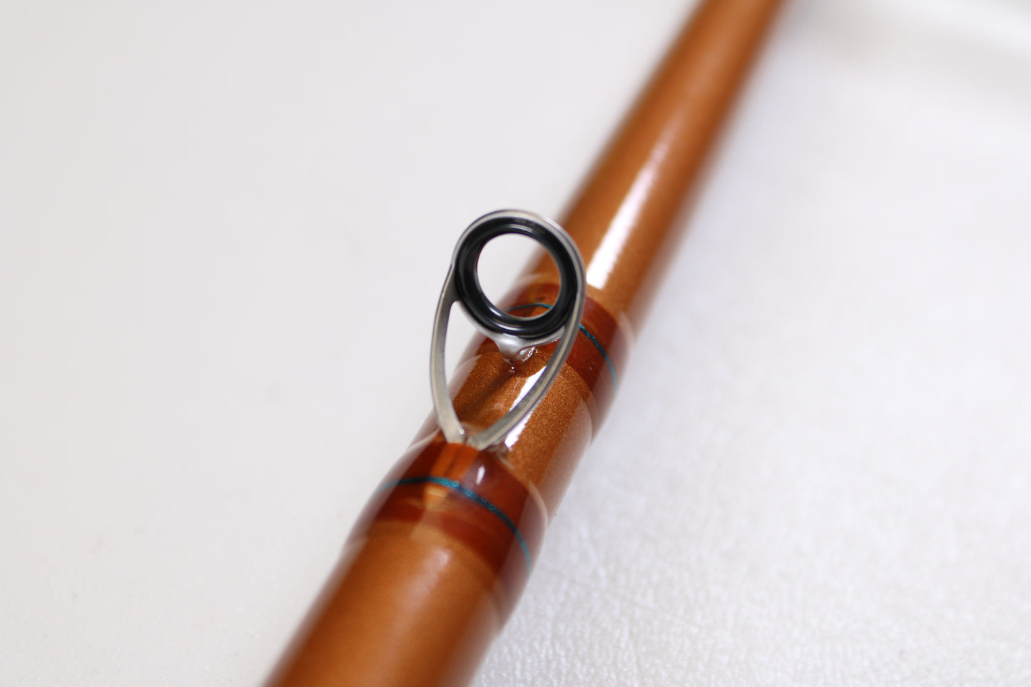 Close-up of a St. Croix Legend Glass LGC88HM 8'8" Heavy used casting rod in mint condition, featuring a metal line guide, against a white background—ideal for upgrading with our rod and reel trade-in program for store credit.