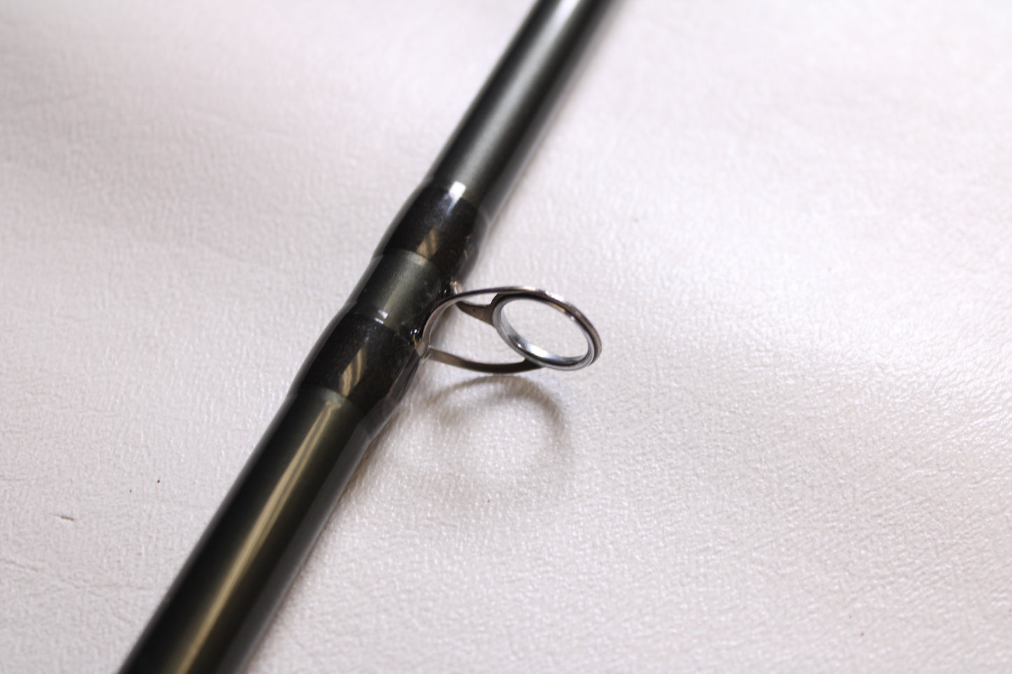 Close-up of a Temple Fork TFO Tactical Elite Bass TLE SB 726-1 7'2" Heavy Used Casting Rod in excellent condition—an ideal choice for those upgrading gear through our rod and reel trade-in program.