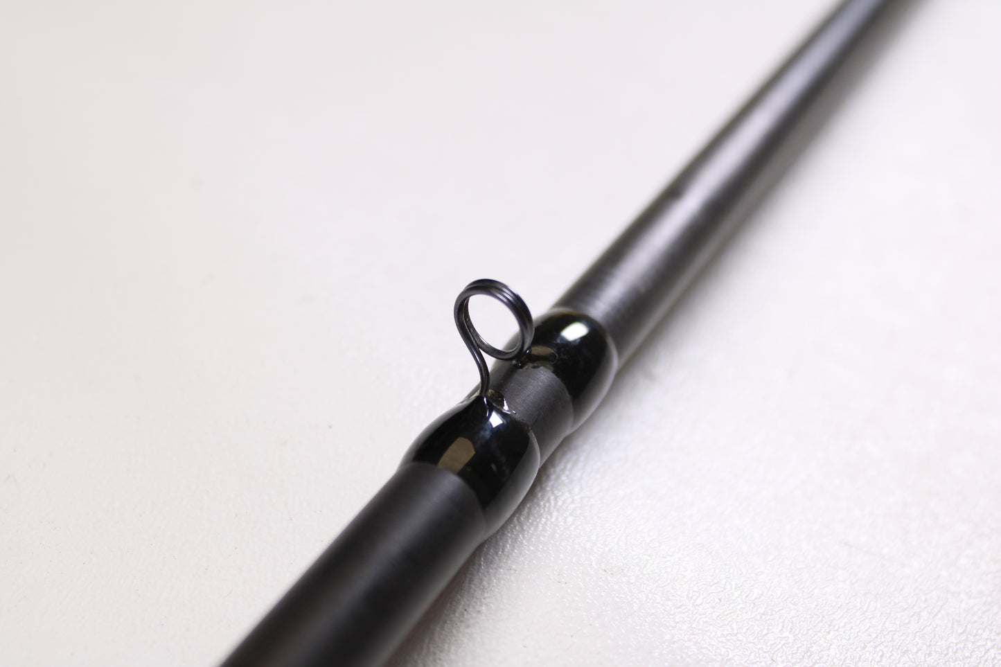 Close-up of a 13 Fishing Envy Black EBC711H 7'11" Heavy Casting Rod in very good used condition—an ideal choice for anyone considering an upgrade or taking advantage of our rod and reel trade-in program.