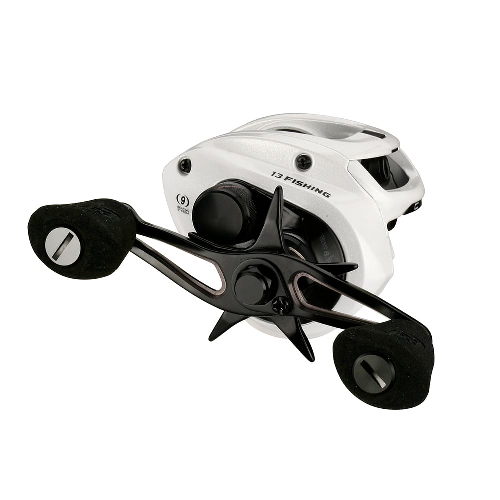 The 13 Fishing Concept C2 Casting Reel 5.6:1 (C2-5.6-RH) features a white finish, black double handle with ergonomic grips, star-shaped drag knob, and is labeled "13 Fishing" for a sleek, high-performance look.