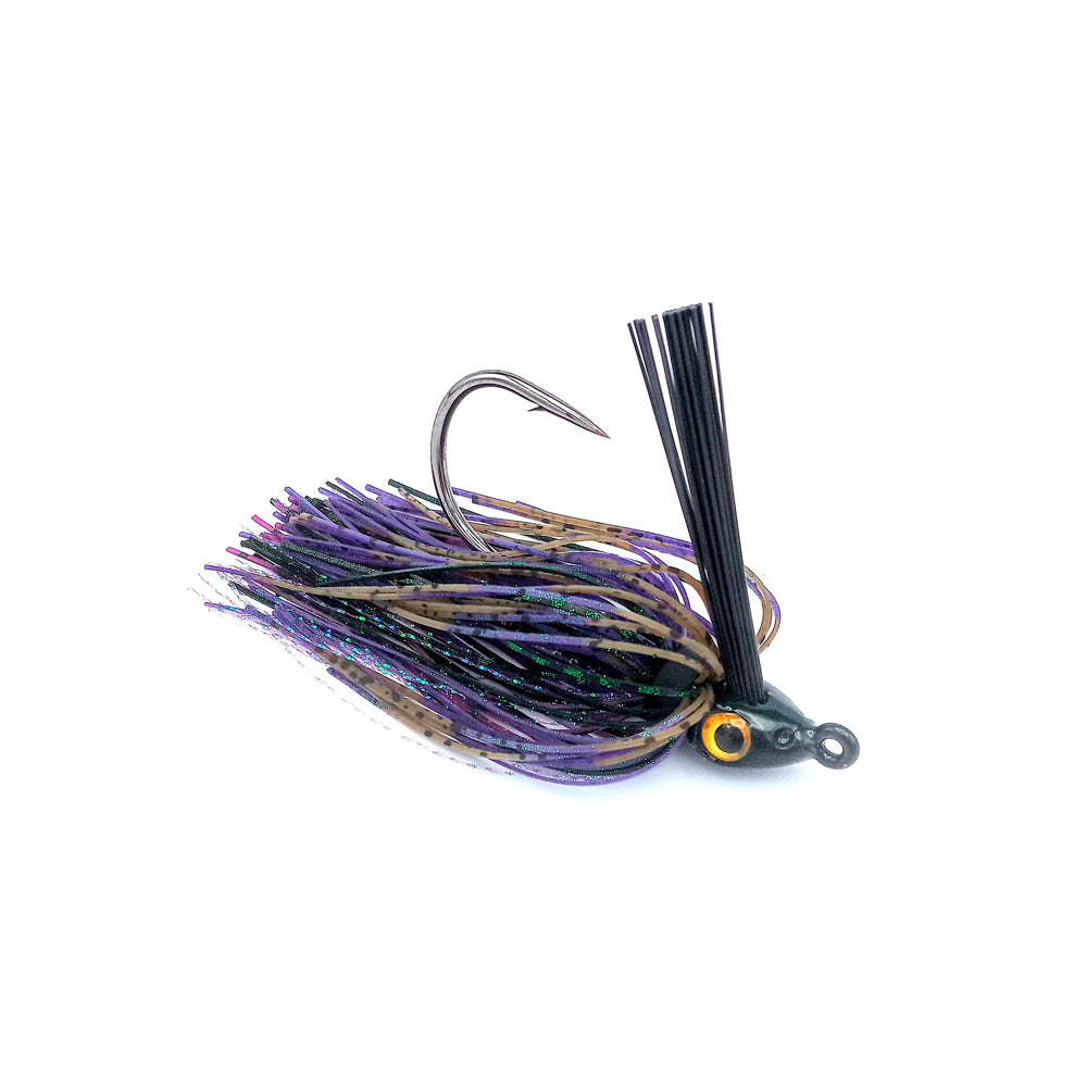 The Beast Coast Zero Flex Gorilla Swim Jig V1 7/16oz. Toxic Bug features a large hook, weed guard, purple, black, and brown skirt strands, and a head with a painted yellow eye, displayed on a white background.
