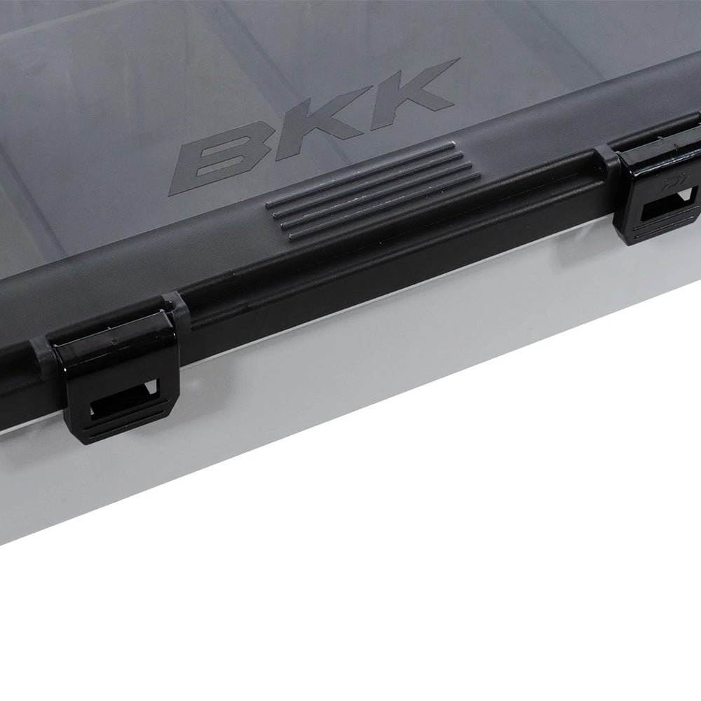 Close-up of the BKK OCD Tackle Storage System | H-BC-1011, a translucent organizer with a black BKK-labeled lid, two black snap closures, and textured grip area—ideal for securely storing your fishing gear.