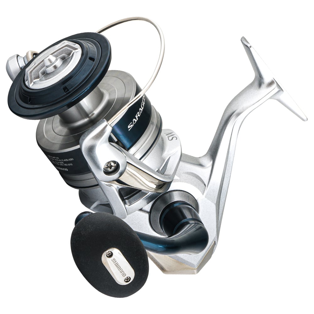 A close-up of the Shimano Saragosa Spinning Reel 14000SWAXG by Shimano, in silver and blue with a black handle and metal parts, displayed on a white background.