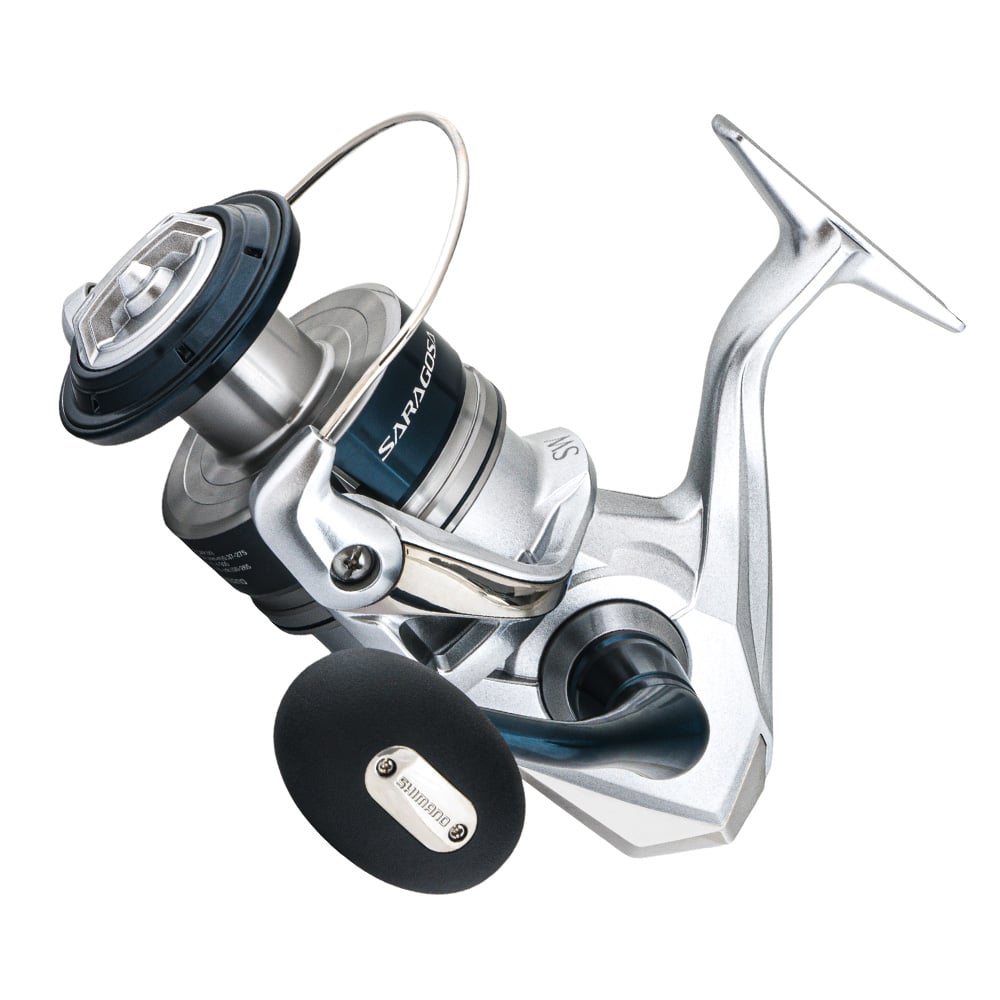 The Shimano Saragosa Spinning Reel 8000SWA 5.6:1 (SRG8000SWAHG) is a silver and black saltwater reel with a round, upward-angled handle labeled "Shimano," and features advanced Infinity Drive Technology.