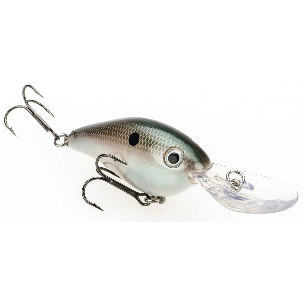 The Strike King 8XD Crankbait by Strike King features a silver and green fish-like body, black spot, two treble hooks, and a clear diving lip—an ideal deep-diving lure for bass fishing enthusiasts.