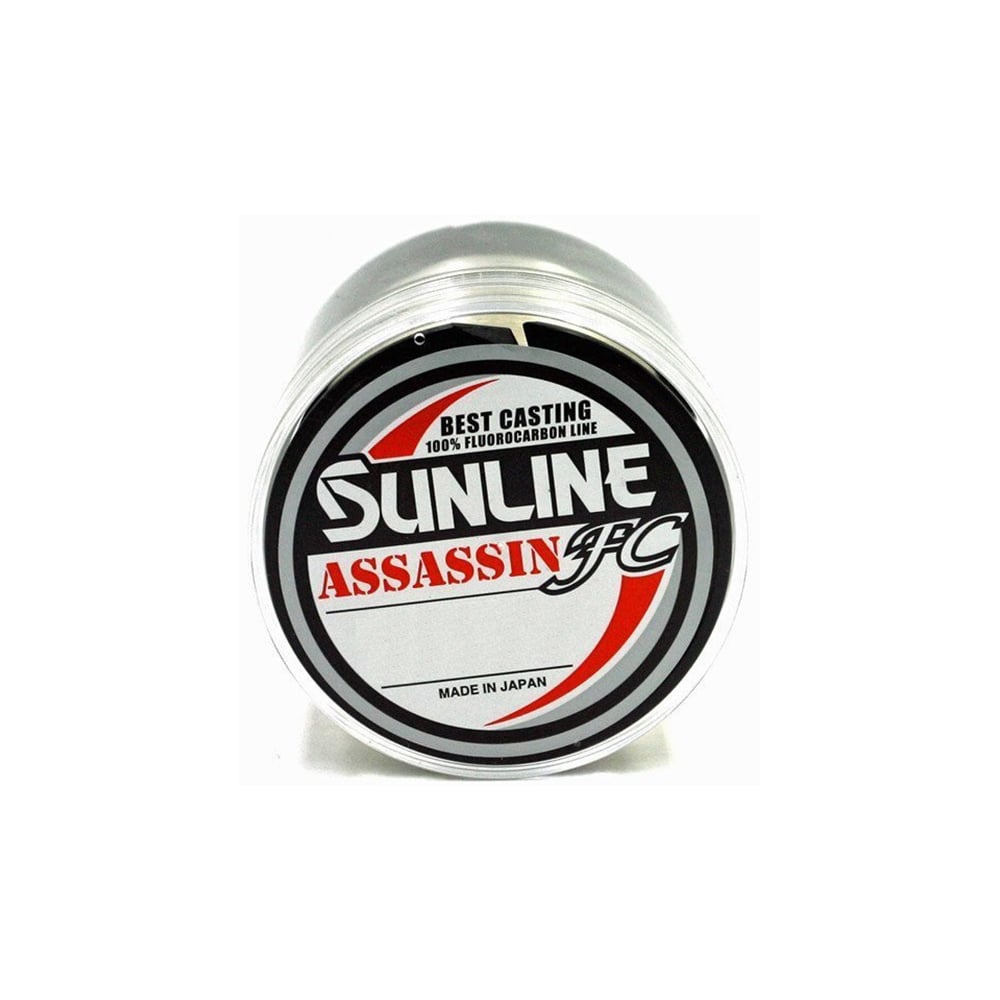 The Sunline Assassin FC Fluorocarbon Line, labeled "Best Casting 100% Fluorocarbon Line, Made in Japan," features Pion Technology for superior abrasion resistance. Its black and red text stands out on a crisp white background.