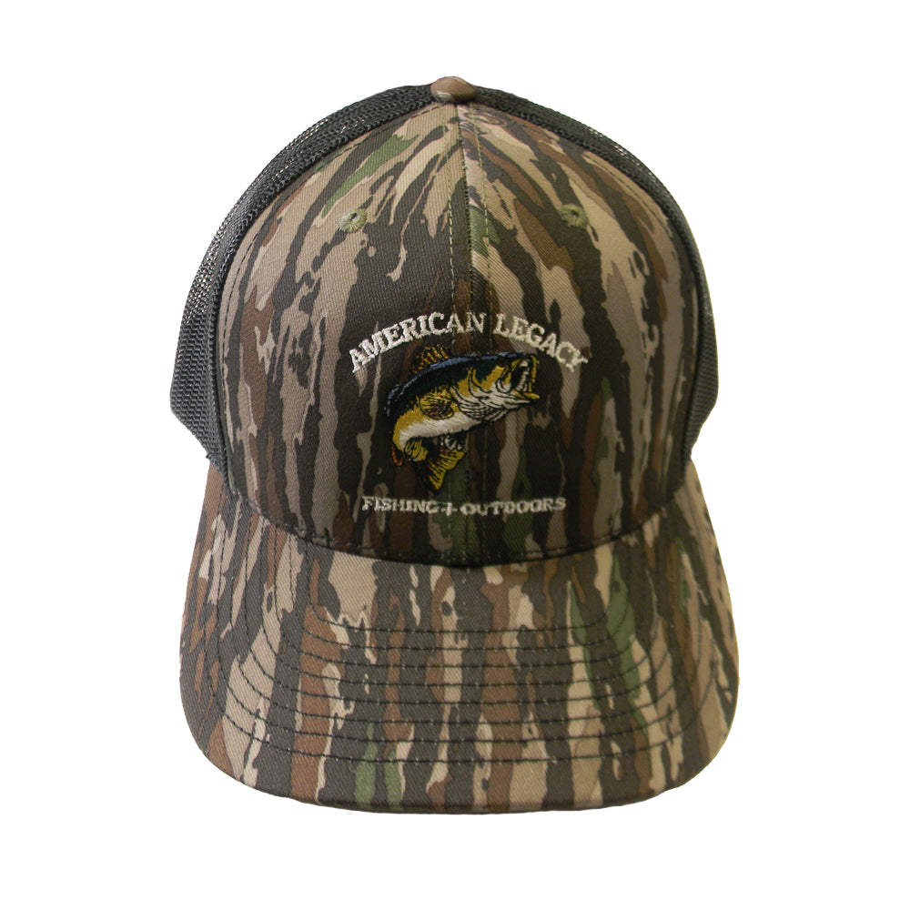 A camouflage-patterned trucker hat featuring a mesh back, an embroidered bass fish design, and the text "American Legacy" above "Fishing + Outdoors." Made by American Legacy Fishing & Outdoors.