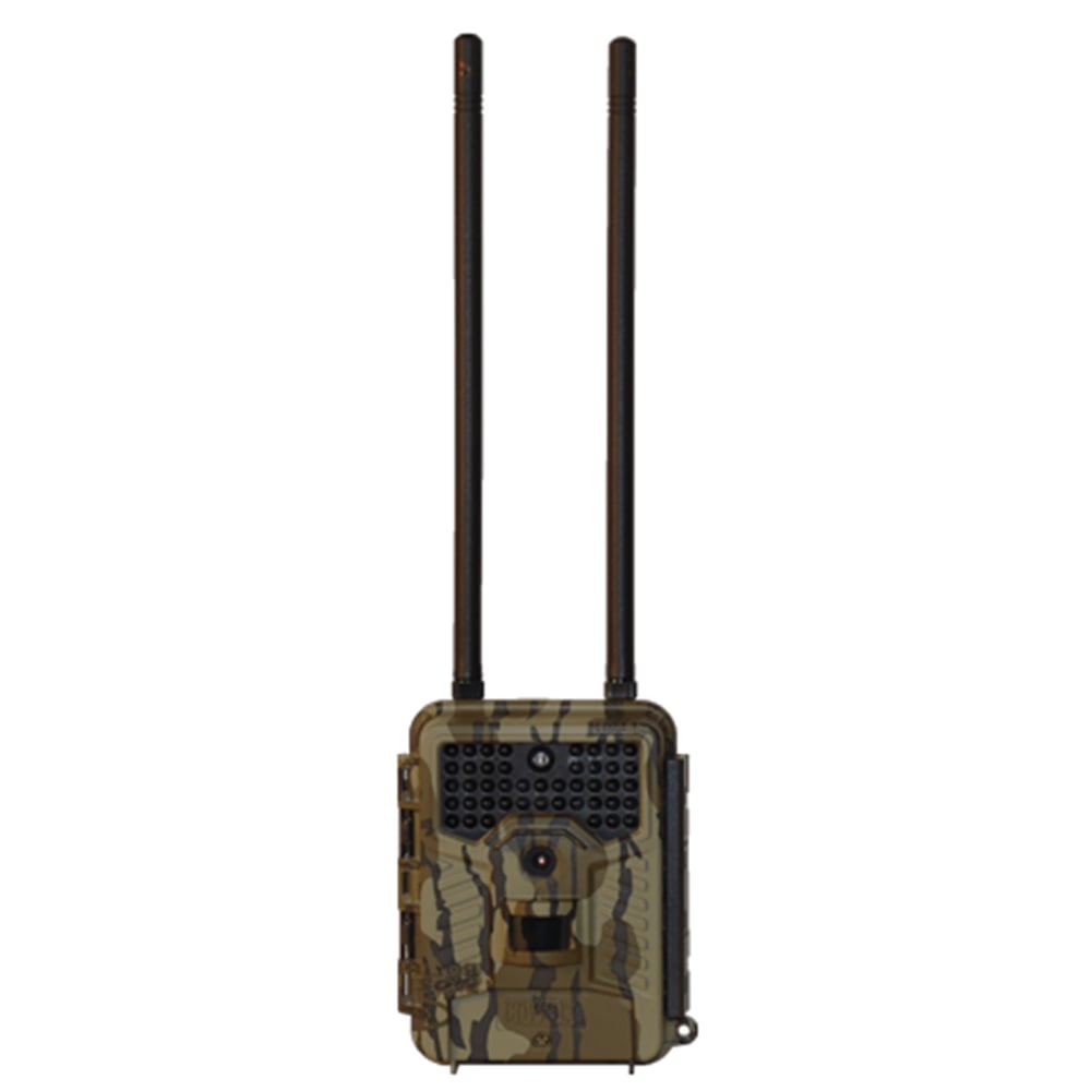The Covert DLC E1 Verizon Game Camera | 5588 is a camouflage trail camera with LTE, two long antennas, a central lens, and infrared LEDs above it, perfect for outdoor wildlife monitoring on the Verizon network.