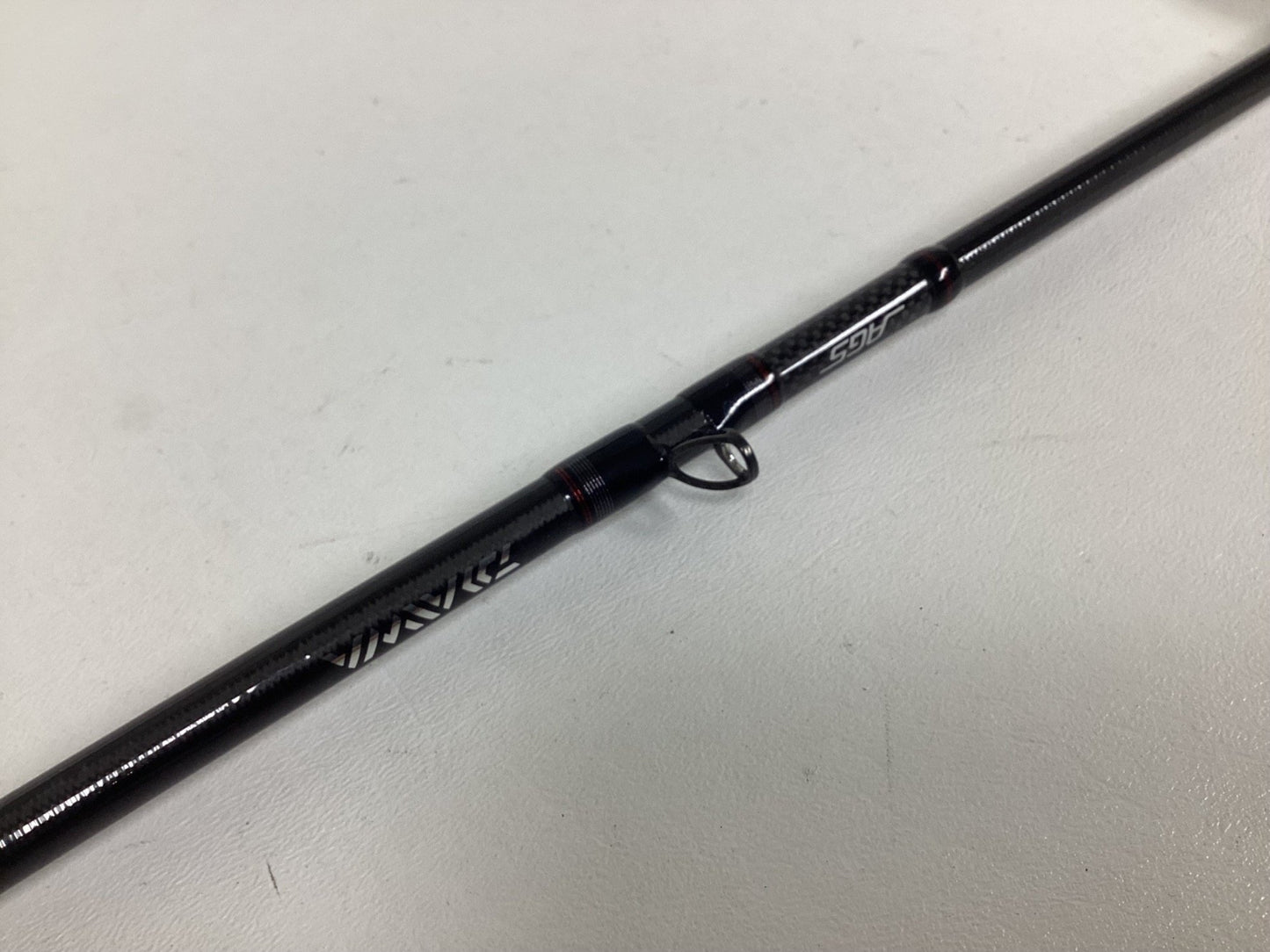 A close-up of a Daiwa Steez AGS STAGS691MHFB Used Casting Rod in excellent condition, highlighting the line guide ring and brand—ideal for those interested in used Daiwa gear or the Rod and Reel Trade-In for store credit.