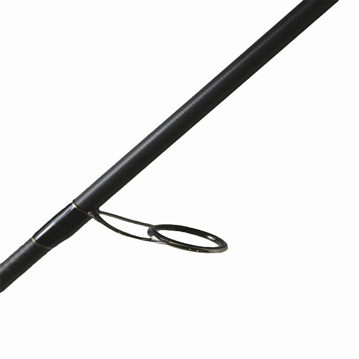 A close-up of the Dobyns Xtasy 7'2" Medium Light Spinning Rod (DRX 722SF) highlights its sleek design with a Fuji Torzite guide ring. Positioned diagonally against a white backdrop, the rod's black finish is accentuated as the ring protrudes underneath.