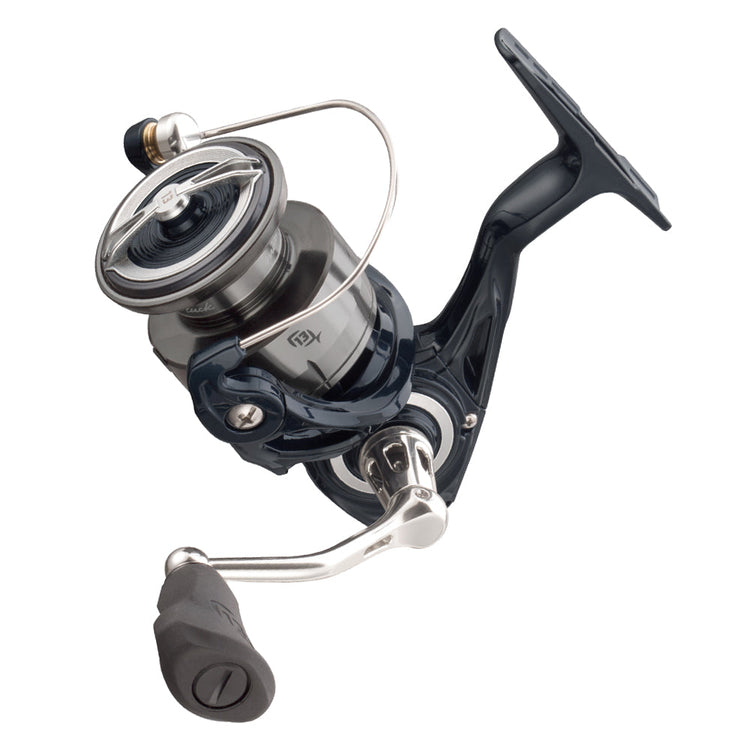 Close-up of a black and silver fishing reel with a spinning mechanism and ergonomic handle. The design features sleek metallic components and a line spool, suitable for spinning rods.