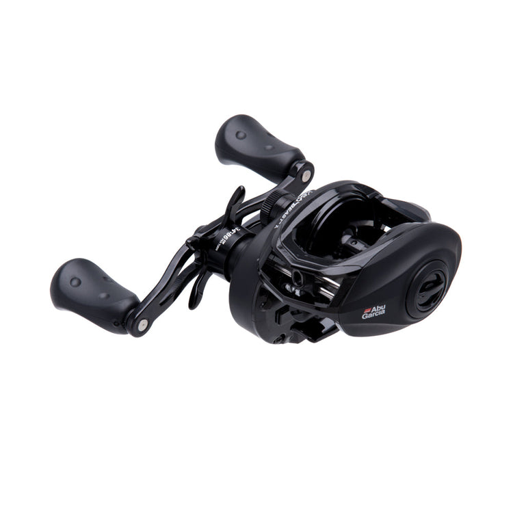 A black fishing baitcast reel with two ergonomic handles, shiny finish, and compact design, set against a plain white background.