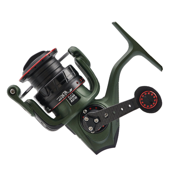 A green fishing reel with black and red accents, featuring a large handle and visible gear ratio markings. It's designed for left-hand use and has a sleek, modern appearance.