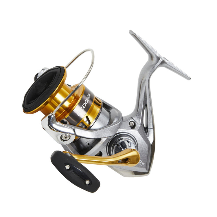 A modern fishing reel with a silver and gold design, featuring a smooth, ergonomic handle and a glossy finish, angled for optimal performance and aesthetic appeal.