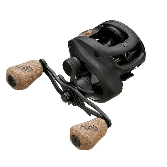 The 13 Fishing Concept A2 Casting Reel 5.6:1 by 13 Fishing features two cork handle grips, a compact black design, Bulldog Carbon Drag, and "13 Fishing" branding on the side.