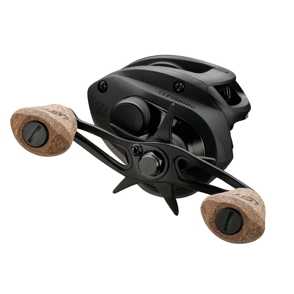 The 13 Fishing Concept A2 Casting Reel 8.3:1 | A2-8.3-RH is a black casting reel with dual cork handle grips, modern styling, and Bulldog Carbon Drag, shown angled on a white background. Brand: 13 Fishing.