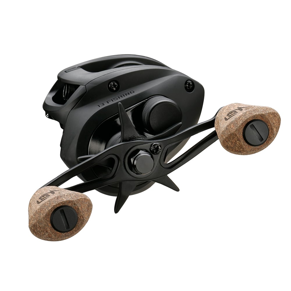 The 13 Fishing Concept A2 Casting Reel Left Hand 5.6:1 (A2-5.6-LH) is displayed against a white background, featuring two tan cork handles, a sleek design, Bulldog Carbon Drag, and the "13 Fishing" brand on the side.