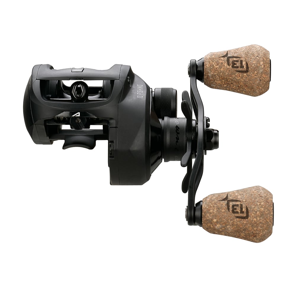 The 13 Fishing Concept A2 Casting Reel Left Hand 8.3:1 (A2-8.3-LH) features a sleek black design with dual cork handles, textured grips, and visible mechanisms, shown from the side against a white background.
