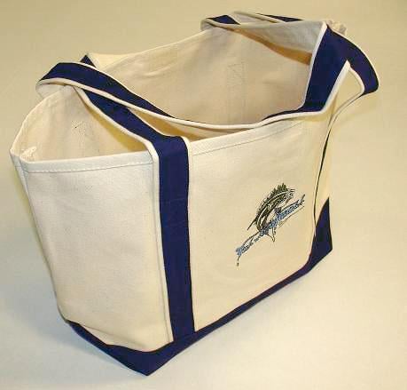 The Fish With Attitude Deluxe Boat Tote Blue by americanlegacyfishing is a limited edition beige canvas tote with dark blue straps and trim, featuring the Miami Dolphins logo embroidered on the side. Perfect for fans on the go!.