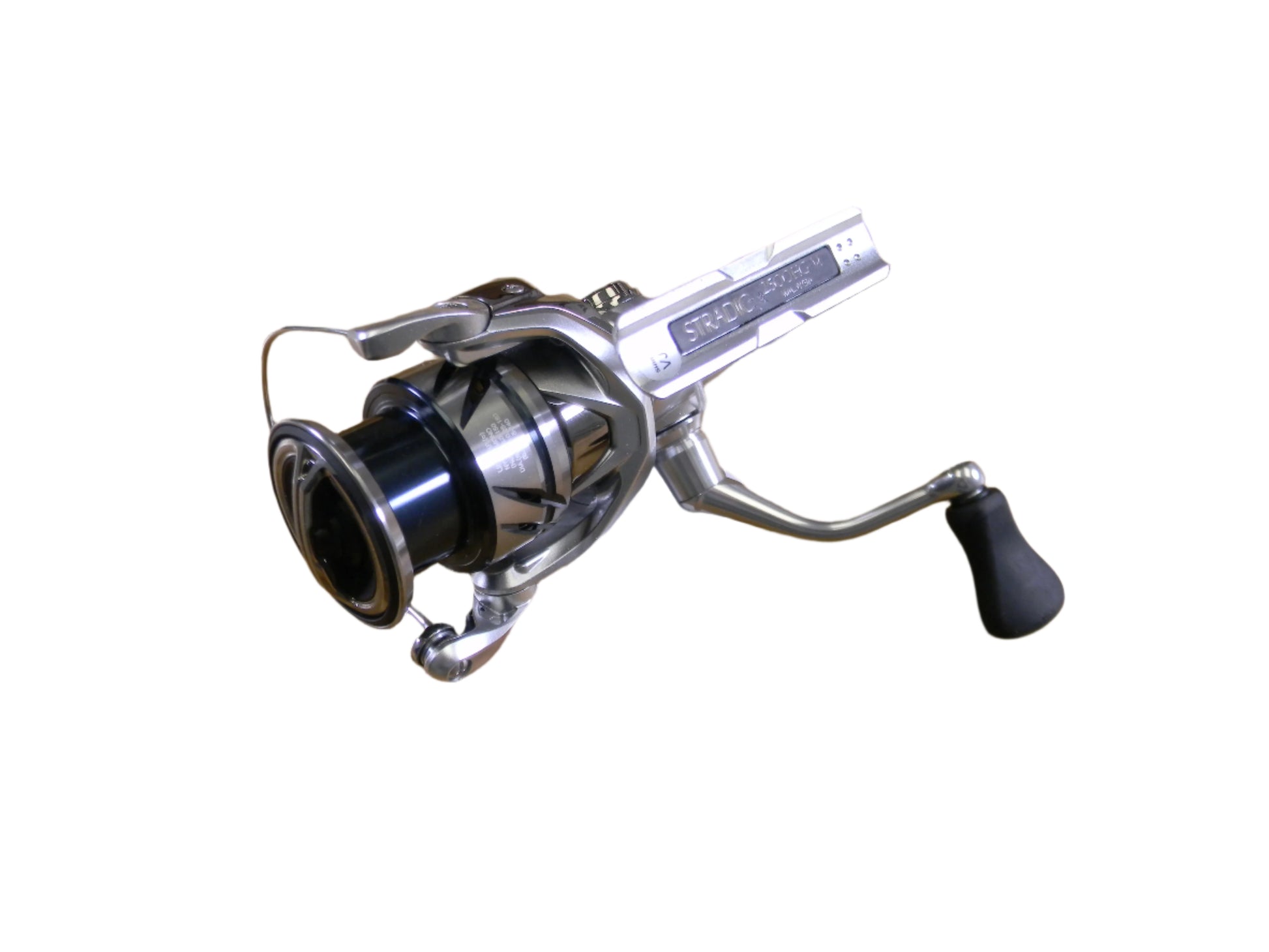 The Shimano Stradic ST2500HGFM is a used spinning reel featuring a silver finish with black spool and handle, perfect for attaching to a rod. Its sleek design makes it ideal for quality fishing enthusiasts participating in our Rod and Reel Trade-In program.