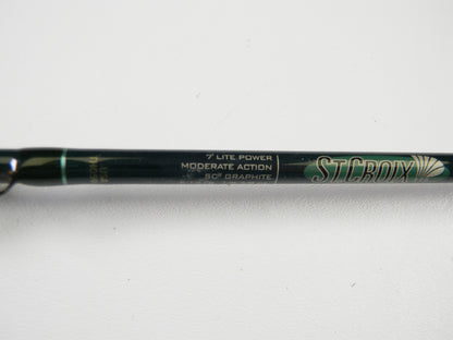 A close-up of a St. Croix Tidemaster TIC70LM 7'0" Light Used Casting Rod in excellent condition, suitable for the Rod and Reel Trade-In Program, with "ST. CROIX" and product details visible on the rod.