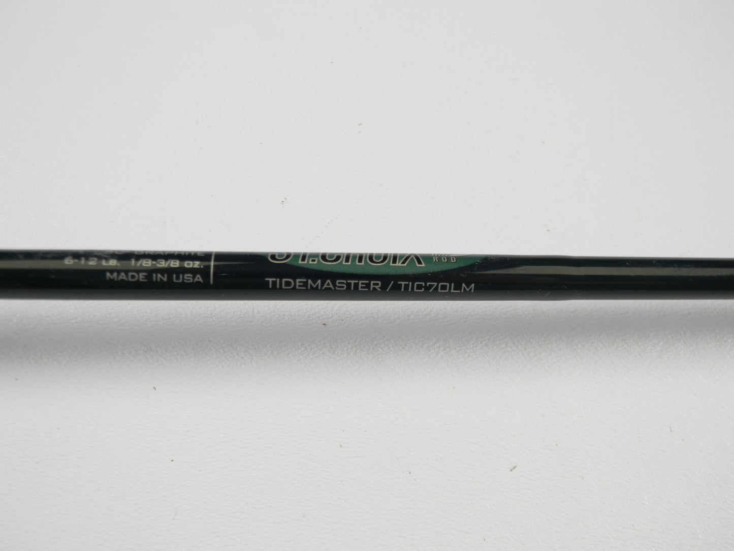 A close-up of a St. Croix Tidemaster TIC70LM 7'0" Light Casting Rod in excellent used condition on a white background—ideal for the Rod and Reel Trade-In Program or earning store credit on used gear.