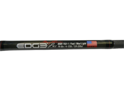 Close-up of an Edge Rods LMX MBR 703-1 casting rod, labeled with "Fast/Med Light LMX 7ft 0in 4-12lb 1/8-3/8oz" and an American flag graphic saying "Made in USA." Ideal for our Rod and Reel Trade-In Program to earn store credit on quality used gear.