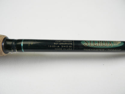 Close-up of a St. Croix Tidemaster TIC66HF, 6'6" heavy rod with fast action, SCII graphite, rated for 12-25 lb and 3/4-2 oz. Made in the USA. Upgrade through our Rod and Reel Trade-In Program to earn store credit by choosing this excellent condition used casting rod.