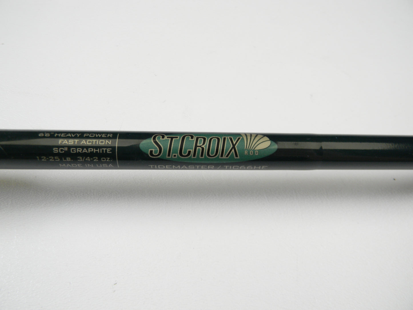 Close-up of a St. Croix Tidemaster TIC66HF 6'6" Heavy - Used Casting Rod displaying "SCII Graphite, Fast Action, 1-2.5 lb. 3/4-2 oz., Made in USA." Ideal for the Rod and Reel Trade-In Program where you trade used gear for store credit on your next adventure.