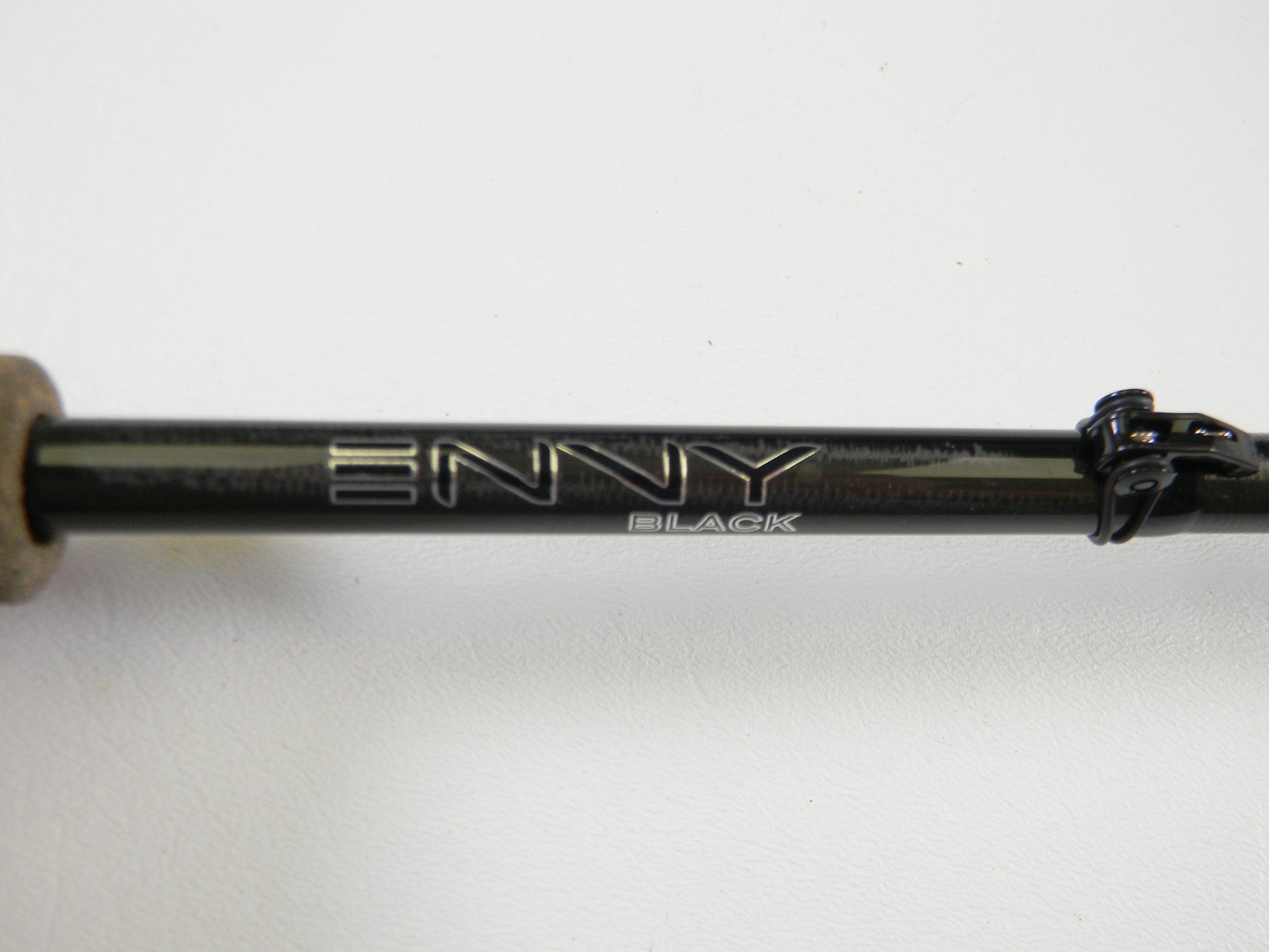 A close-up of a 13 Fishing Envy Black 3 EB3C71M 7'1" Medium Casting Rod in excellent used condition, featuring "ENVY" and "BLACK" on the black rod, set against a white background.