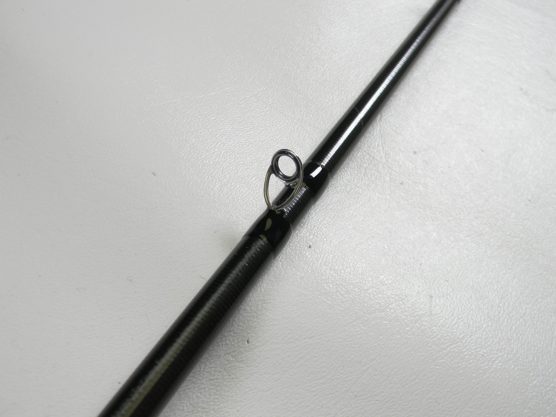 Close-up of a 13 Fishing Envy Black 3 EB3C71M 7'1" Medium Used Casting Rod in excellent condition, highlighting a line guide—ideal for evaluating gear for our Rod and Reel Trade-In and store credit offers.